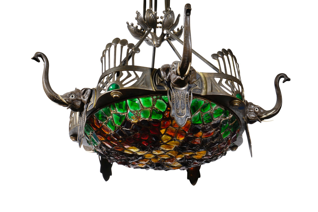 AN AUSTRIAN ART DECO SILVERED BRONZE AND COLORED GLASS ELEPHANT MOTIF CHANDELIER