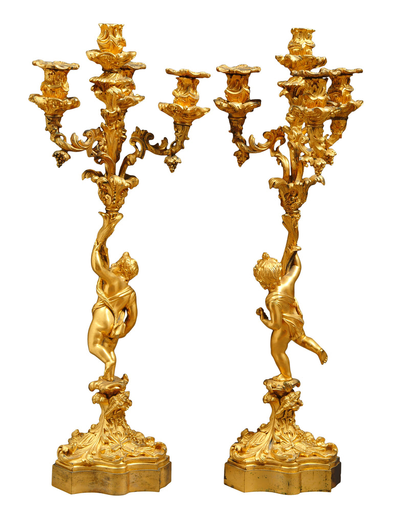 A PAIR OF ANTIQUE FRENCH VICTORIAN GILT BRONZE FOUR LIGHT FIGURAL CANDELABRAS