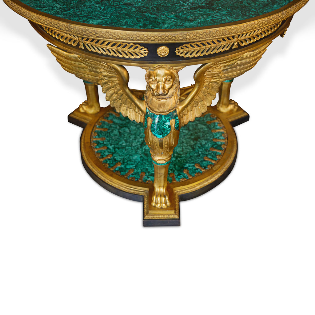 A FRENCH EMPIRE STYLE GILT BRONZE AND MALACHITE CENTER TABLE