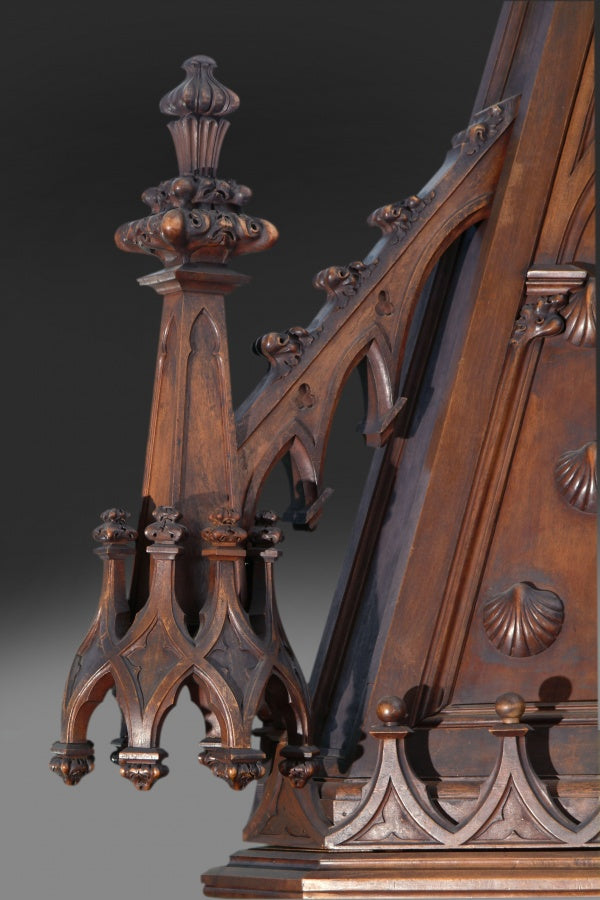 A MONUMENTAL ENGLISH GOTHIC STYLE CARVED WALNUT FIREPLACE
