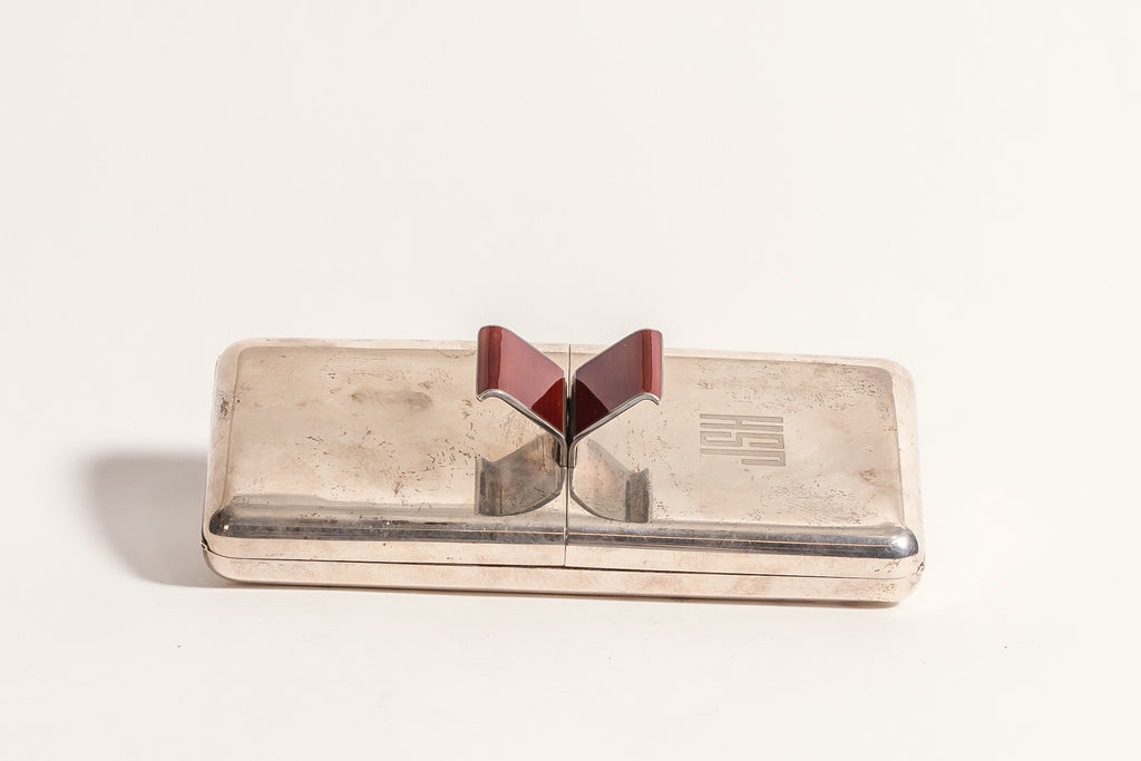 A NORWEGIAN STERLING SILVER AND RED ENAMEL BOX BY J. TOSTRUP