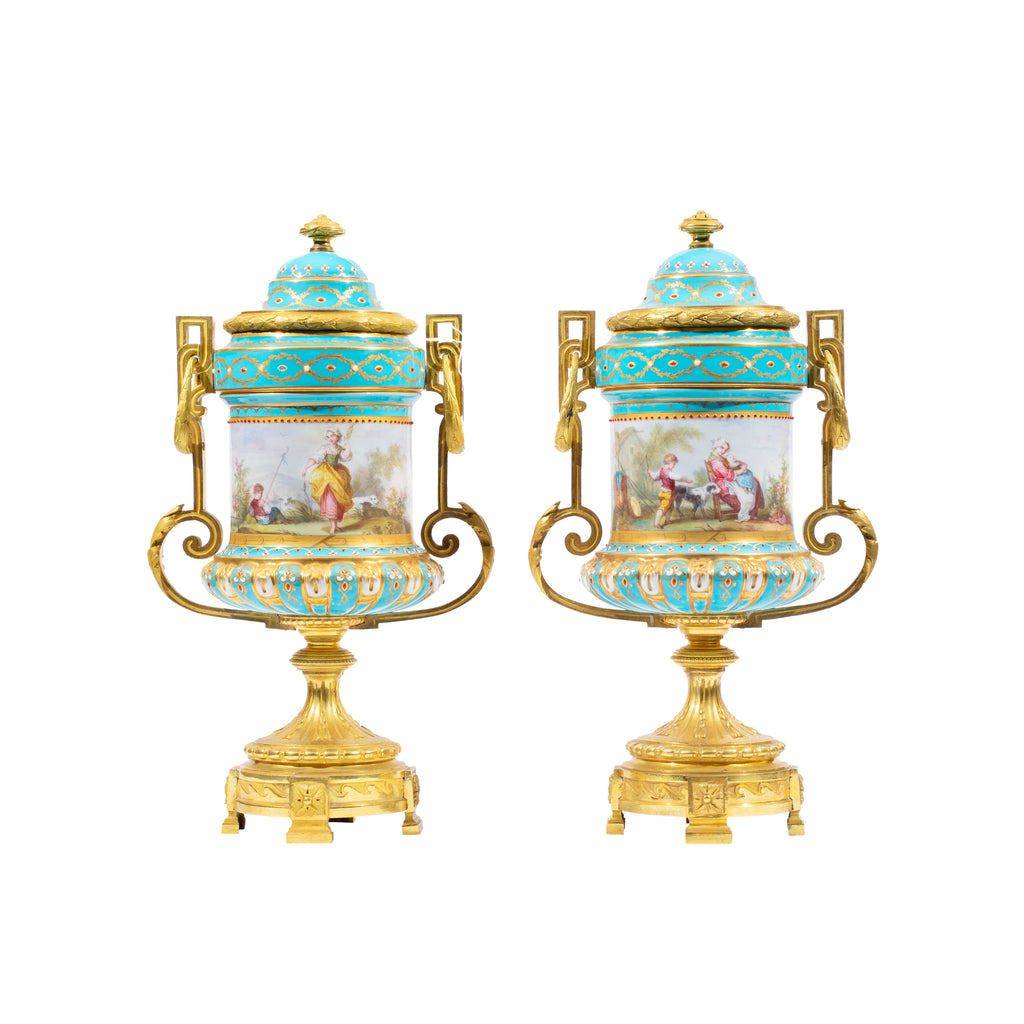 A FINE PAIR OF FRENCH ORMOLU MOUNTED SEVRES STYLE PORCELAIN JEWELED VASES