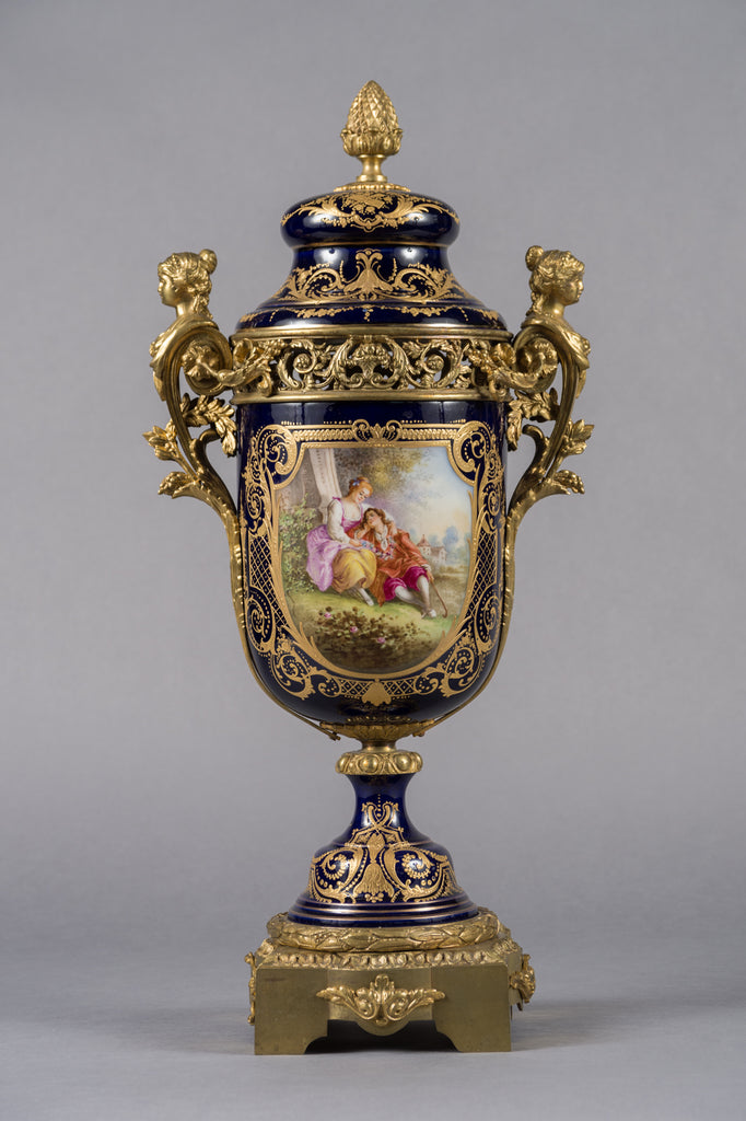 PAIR OF FRENCH SEVRES STYLE PORCELAIN AND GILT BRONZE MOUNTED LIDDED VASES, 19TH CENTURY