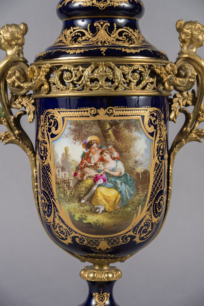 PAIR OF FRENCH SEVRES STYLE PORCELAIN AND GILT BRONZE MOUNTED LIDDED VASES, 19TH CENTURY