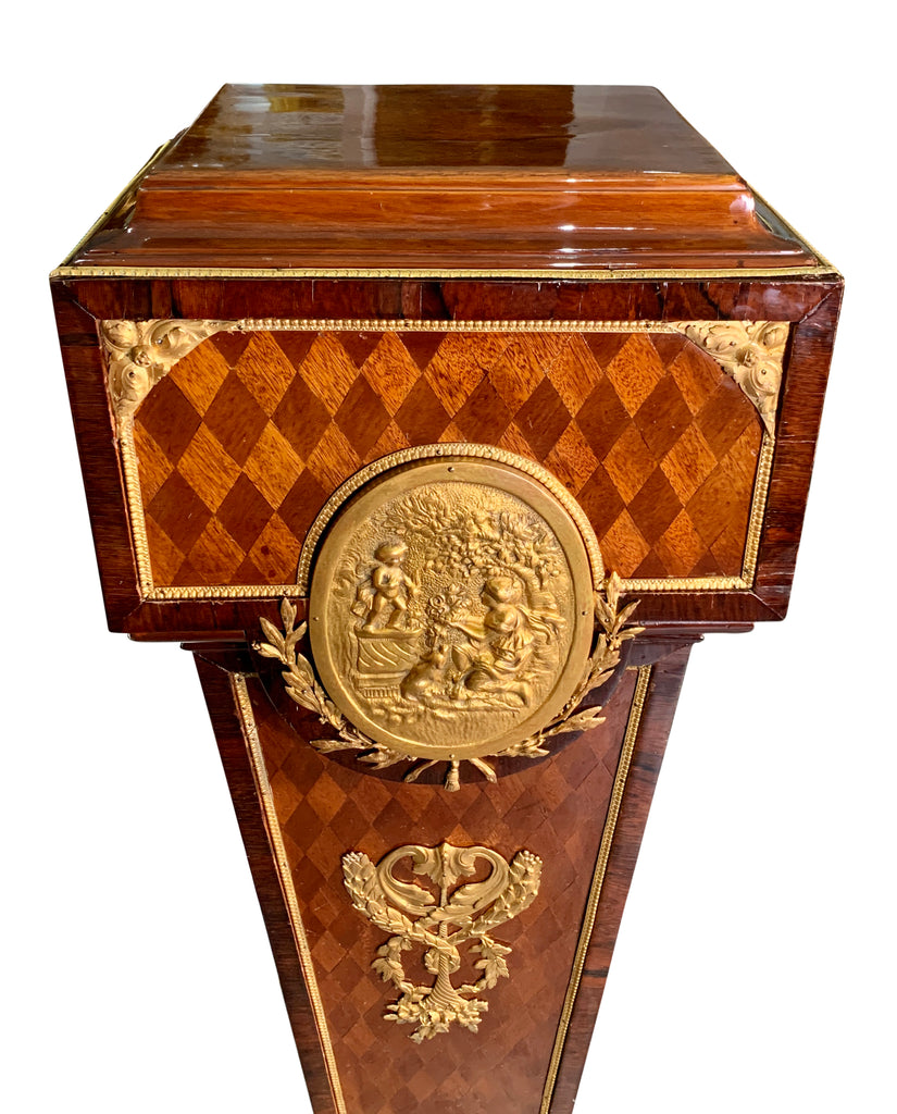 Pair of French gilt bronze mounted parquetry pedestals with oval plaque