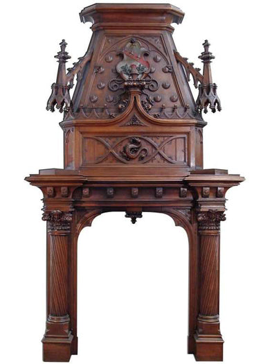 A Monumental 19th century Gothic Style Carved Walnut Fireplace