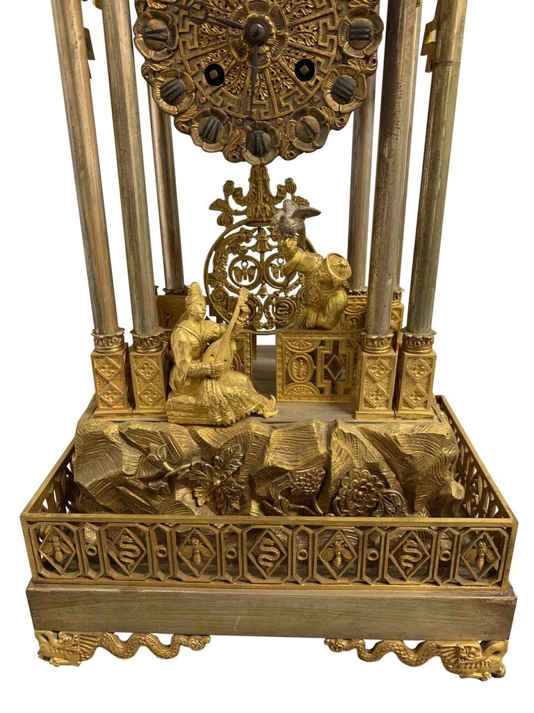 AN EXCEPTIONAL SILVERED & GILT BRONZE CHINOISERIE CLOCK GARNITURE MADE FOR THE CHINESE QING COURT