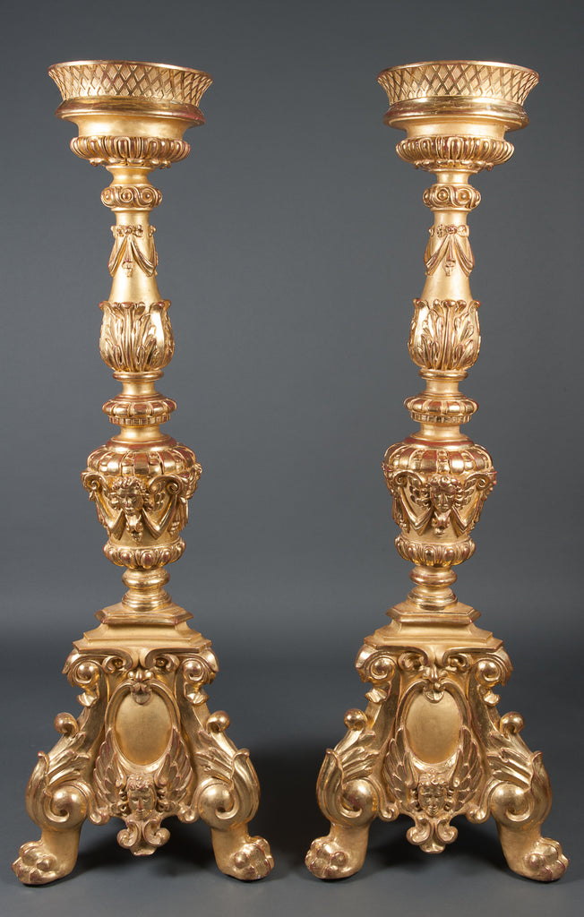 A Pair of monumental Italian carved giltwood torcheres