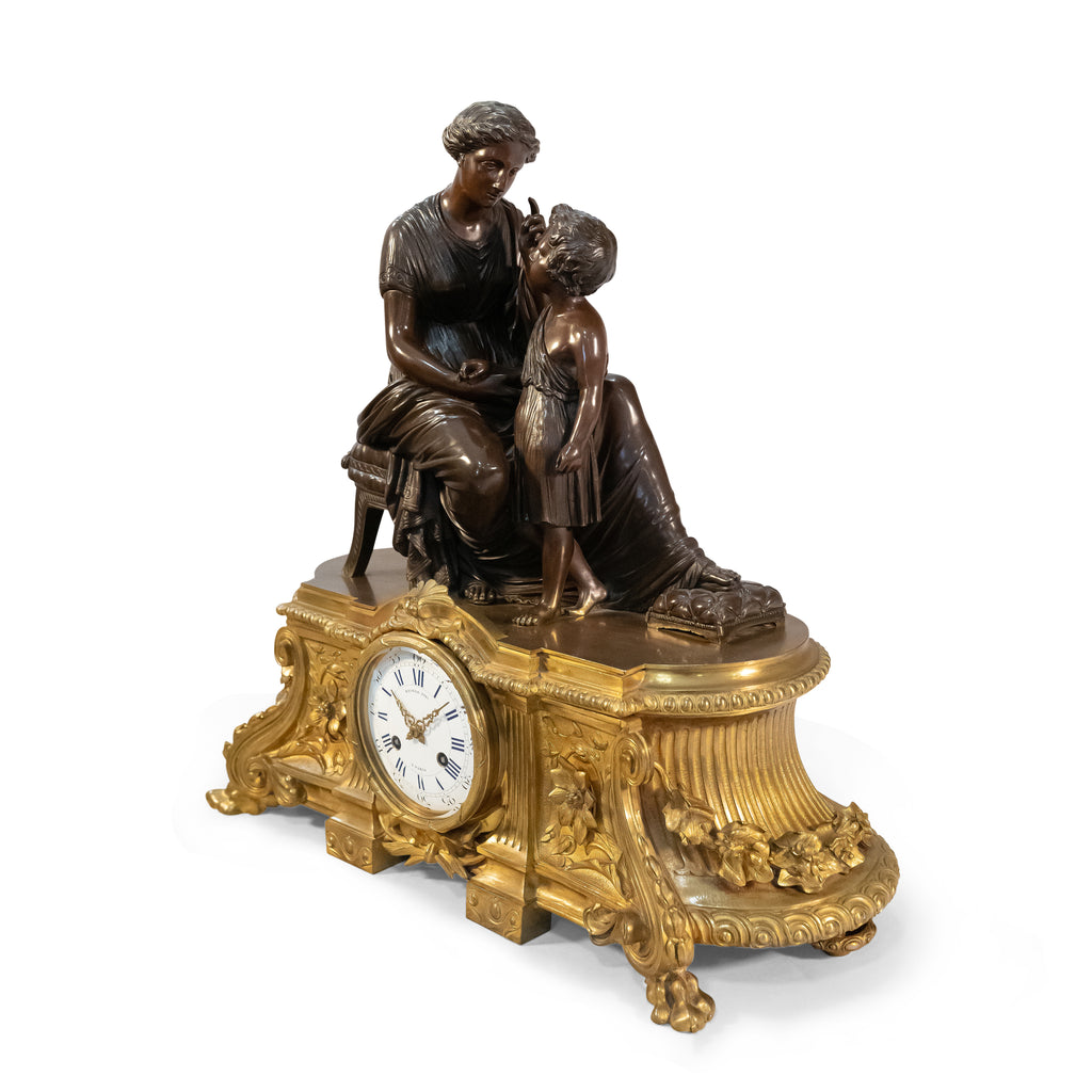 A 19th Century French Gilt & Patinated Bronze Figural Mantel Clock by Raingo
