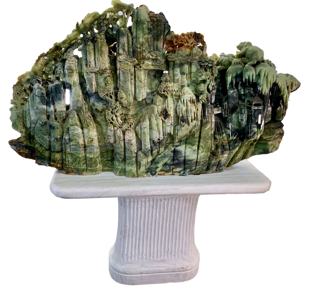 A LARGE CHINESE CARVED SERPENTINE JADE SCULPTURE OF FOREST LANDSCAPE