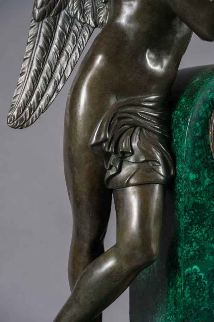 A PALATIAL PATINATED BRONZE & MALACHITE MANTEL CLOCK OF CUPID AND PSYCHE