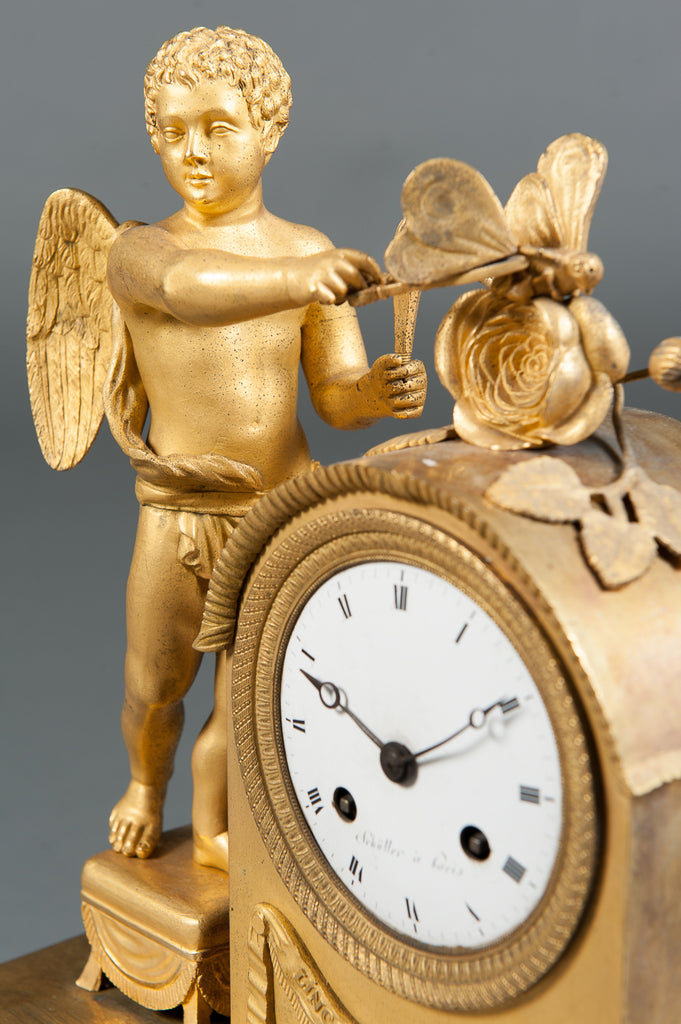 An Early 1800's Gilt Bronze Mantle Cock of a Cherub & Butterfly