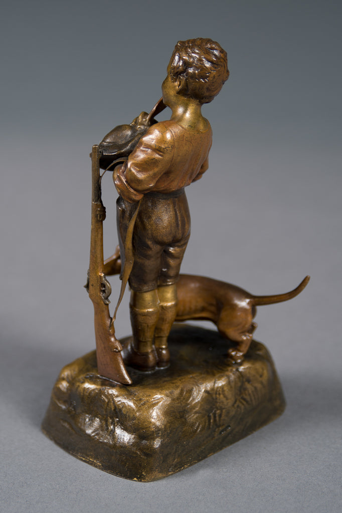 An Antique Austrian Bronze Figure of a Boy with His Dog and a Rifle